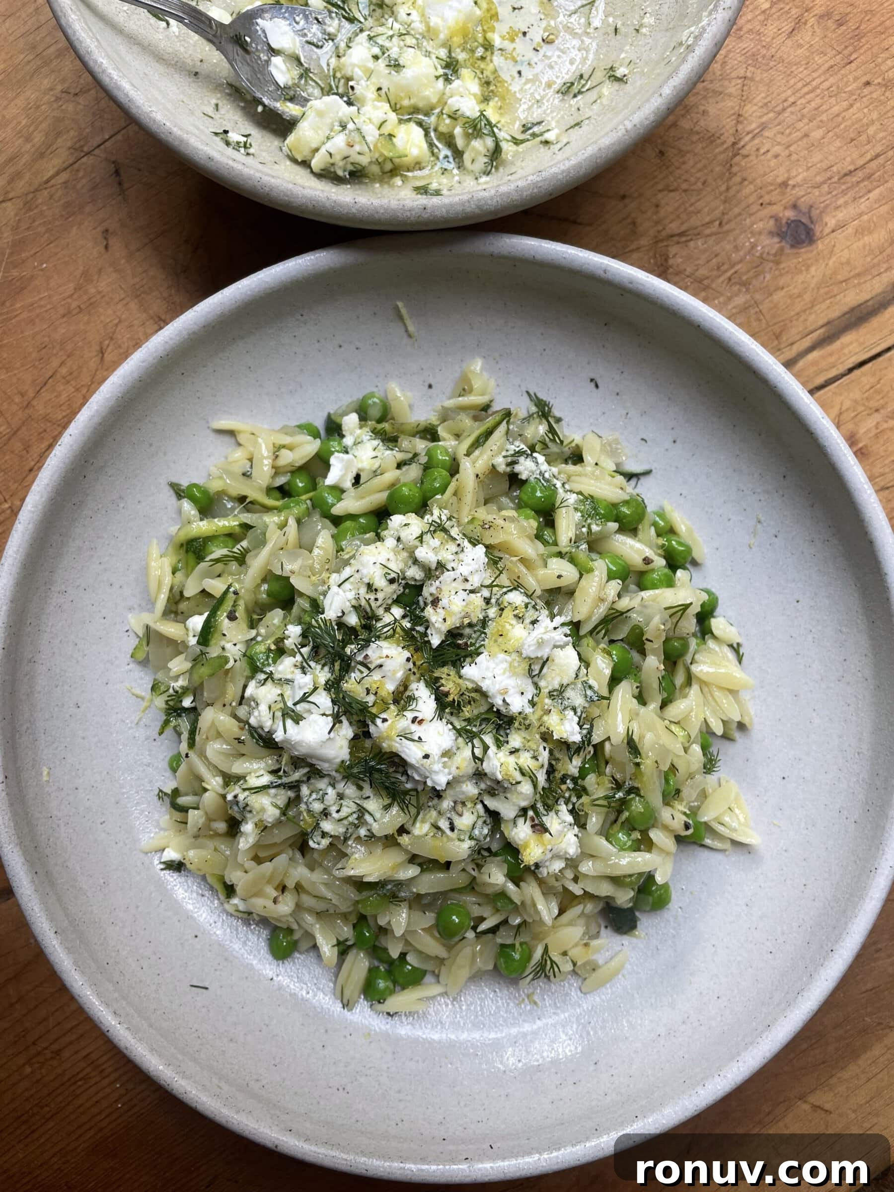 Creamy Lemon Orzo with Feta and Fresh Herbs 3 lemon orzo with feta in a grey bowl.
