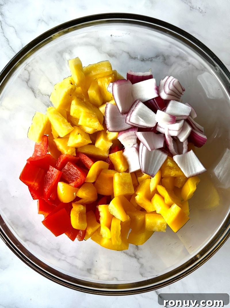 Grilled Pineapple BBQ Chicken Foil Packets 4 Chicken and pineapple on foil before sealing