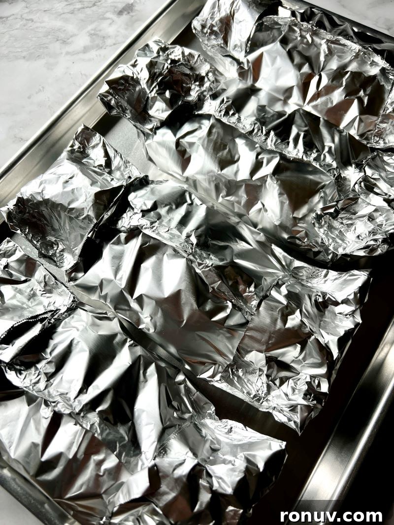 Grilled Pineapple BBQ Chicken Foil Packets 7 Open foil pack showing cooked chicken and veggies