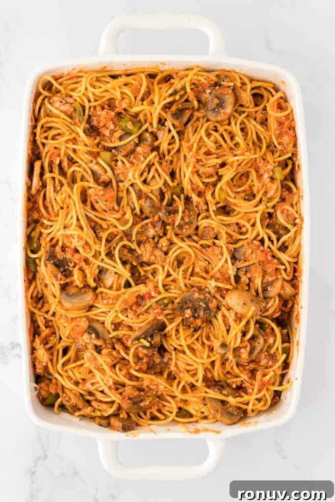 spaghetti mixed with sauce
