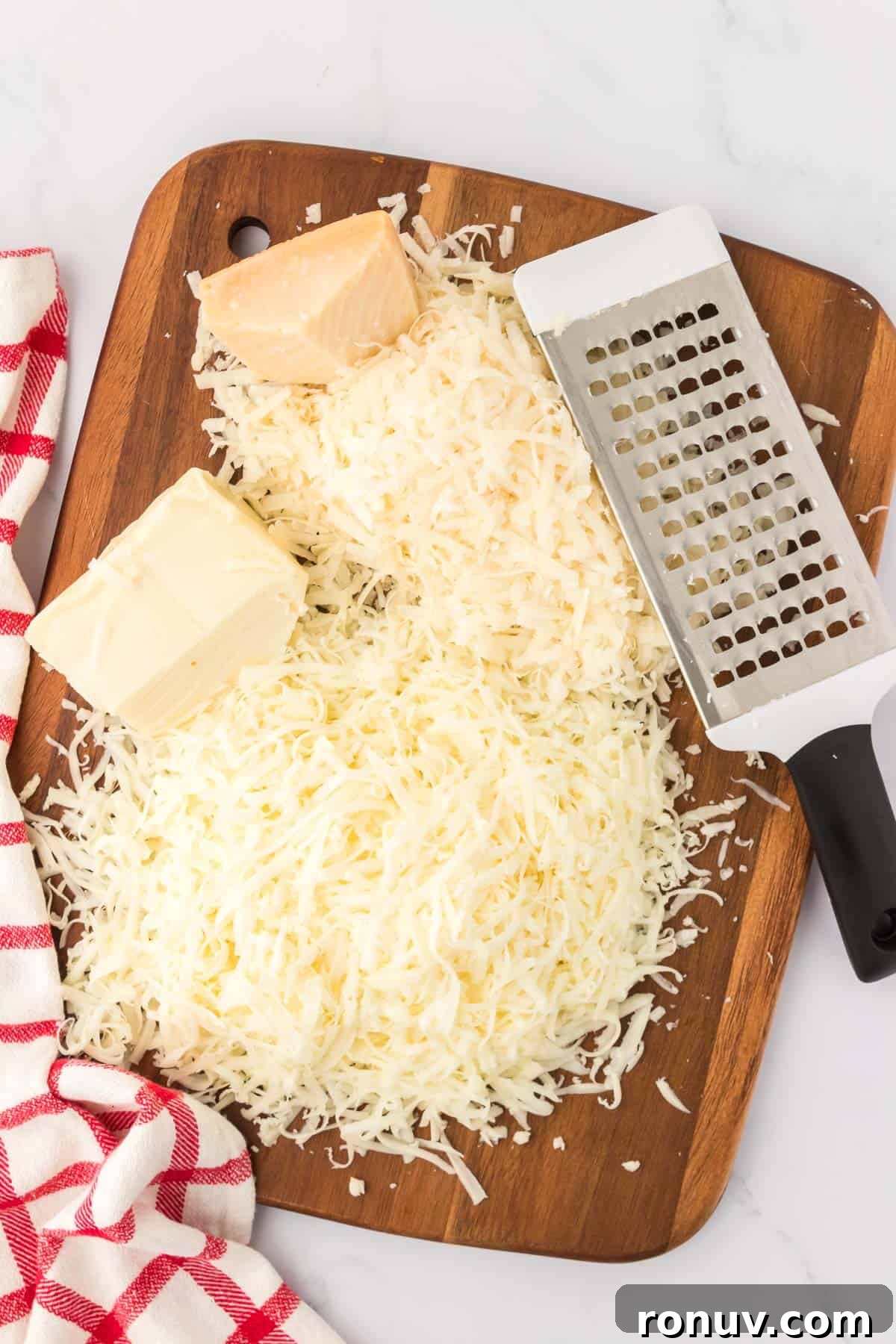 grated cheese on a cutting board