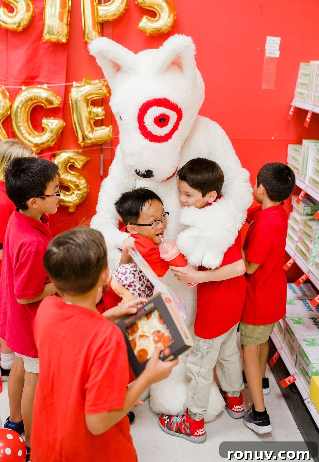 Target-Themed Birthday Party Ideas and Decor 21 kids hugging the mascot