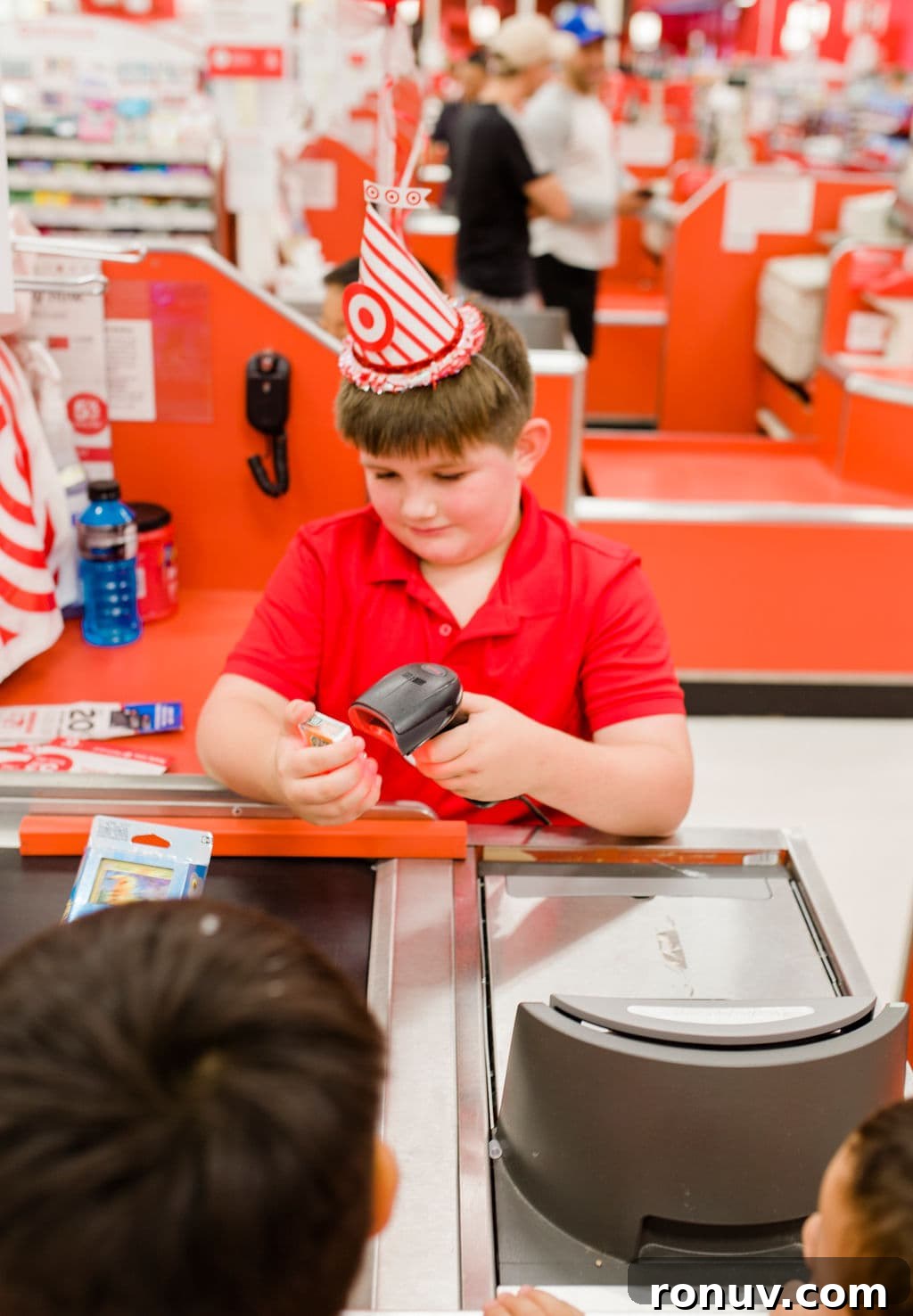 Target-Themed Birthday Party Ideas and Decor 26 boy at a check out