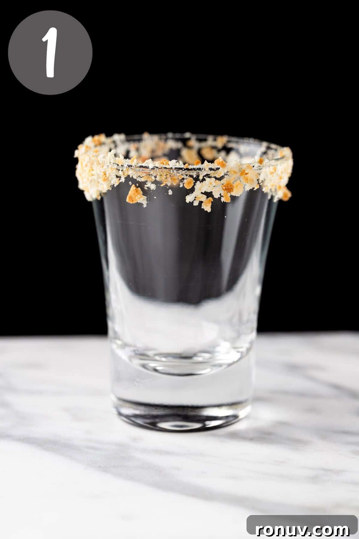 Key Lime Pie Shot Recipe: Creamy Citrus Shooter 4 A shot glass with a graham cracker rim.