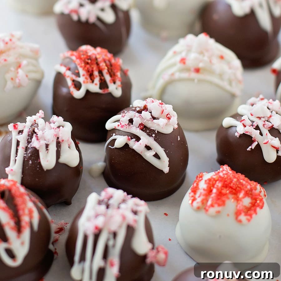 Easy homemade peppermint chocolate truffles are simple and the perfect addition to any holiday party or cookie tray. Peppermint Chocolate Truffles topped with sprinkles and crushed candy cane