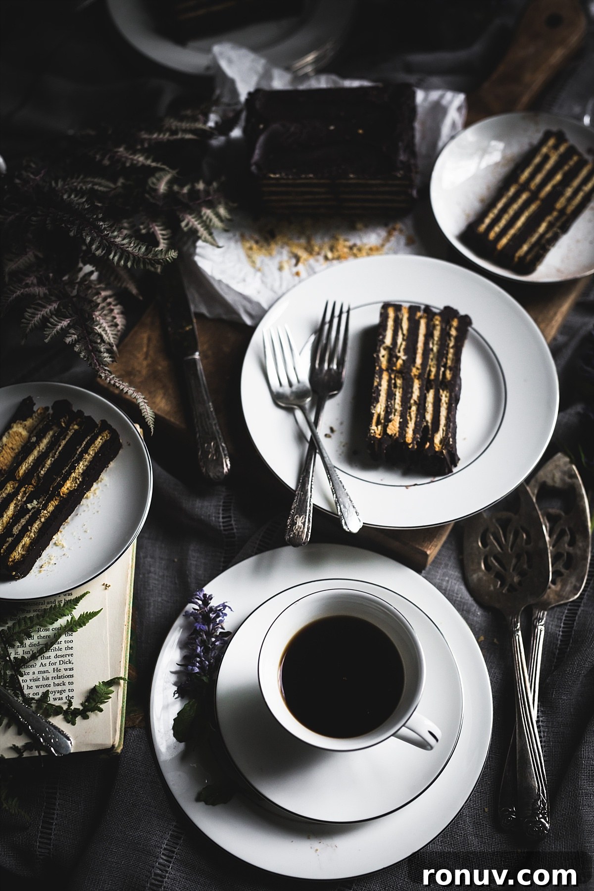 Kalter Hund Recipe: German No-Bake Layered Chocolate Cookie Cake 2 Three plates each with a slice of Kalter Hund and a coffee cup on a saucer.
