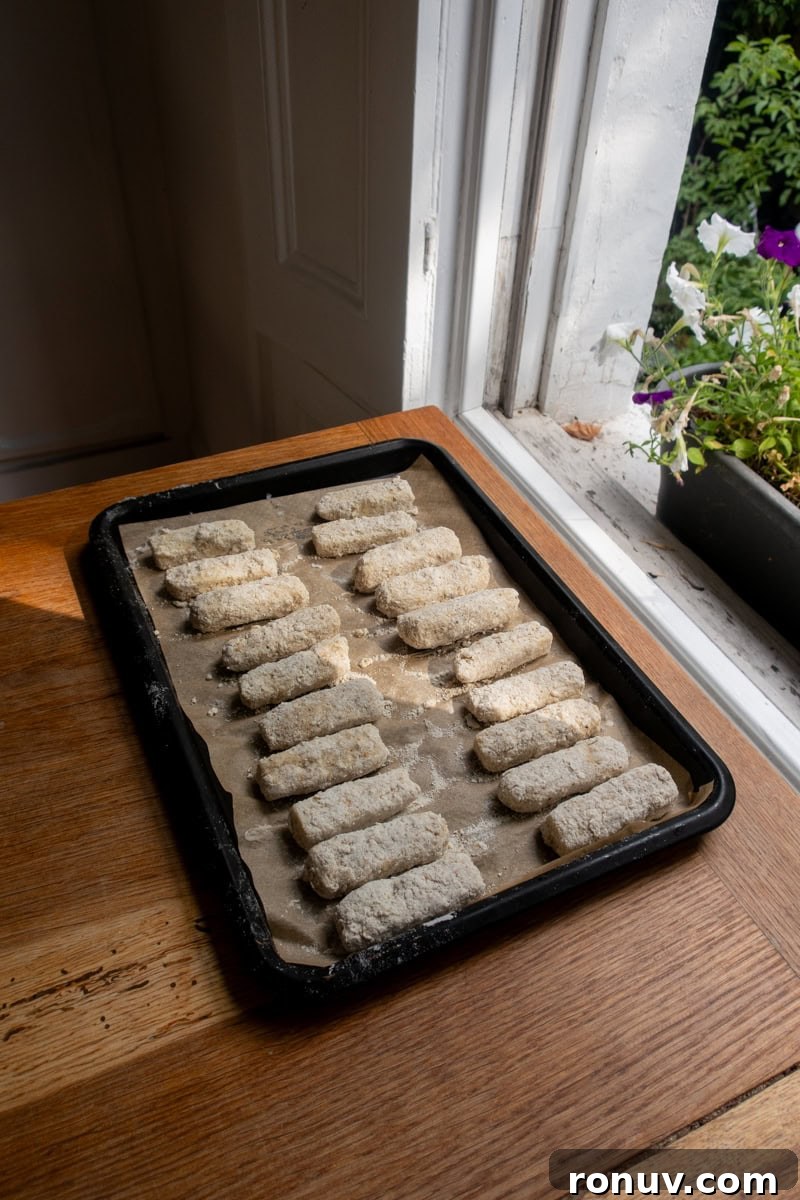 Crispy Mozzarella Sticks with Tangy Tomato Dip 3 Mozzarella Sticks on a tray - Georgie Mullen