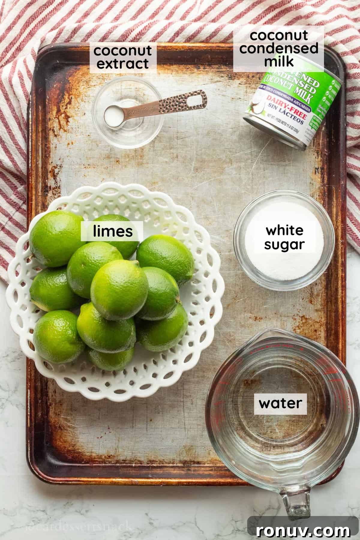 Coconut Lime Cooler: Tropical Drink Recipe 3 Labeled ingredients for coconut limeade on metal tray.