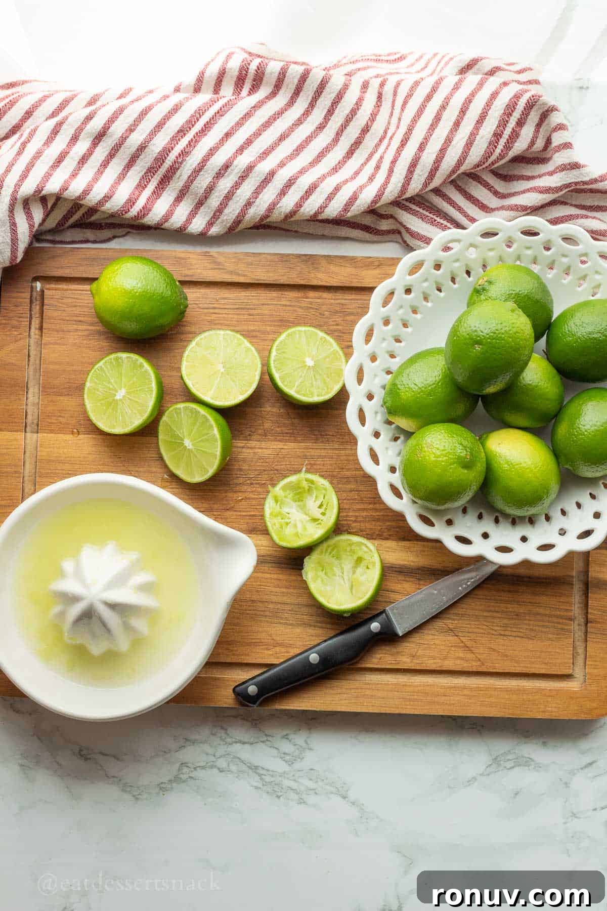 Coconut Lime Cooler: Tropical Drink Recipe 4 Squeezing limes into dish.