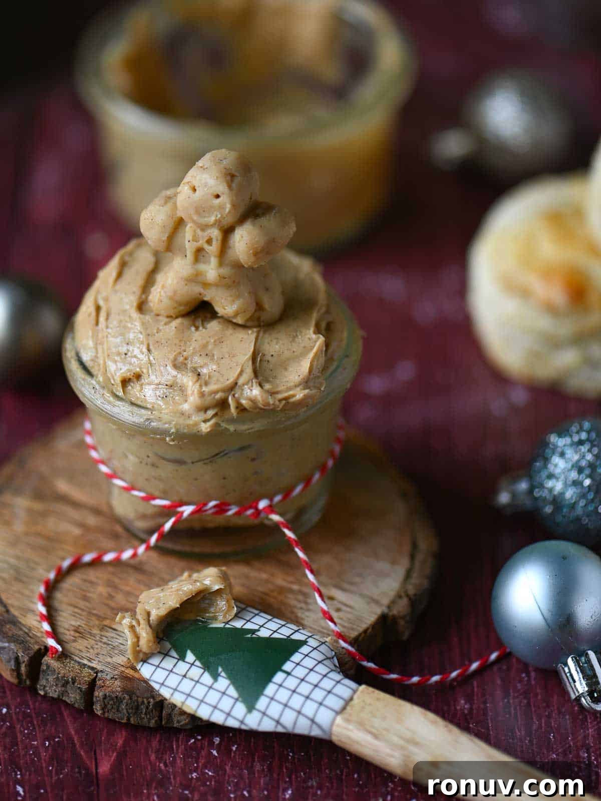 Gingerbread Butter Recipe for the Holidays 2 Gingerbread butter in a clear jar with a gingerbread man on top.
