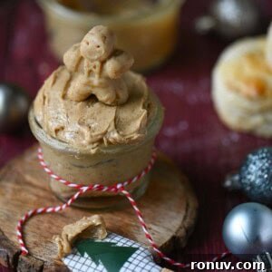 Gingerbread Butter Recipe for the Holidays 10 Close- up of a gingerbread man on gingerbread butter in a clear jar.