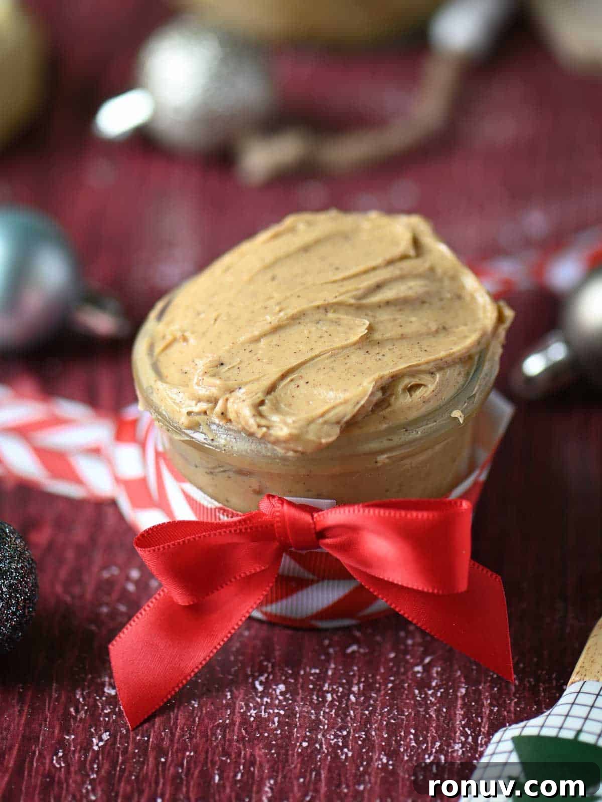 Gingerbread Butter Recipe for the Holidays 3 Gingerbread butter in a clear jar with red ribbon.