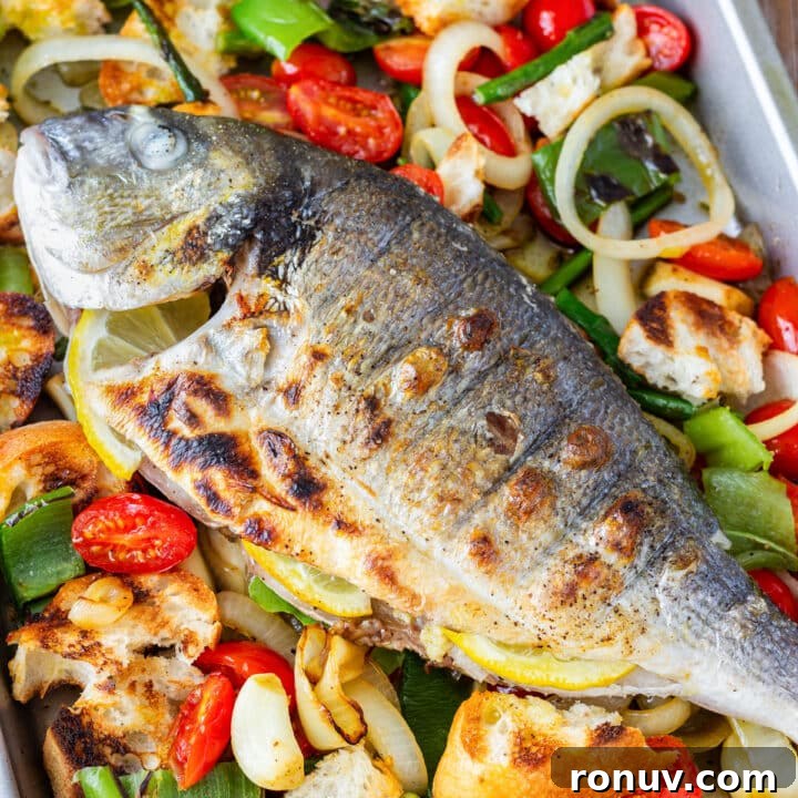 Crispy Campfire Potatoes Recipe 11 Overhead close-up of grilled whole fish with lemon slices