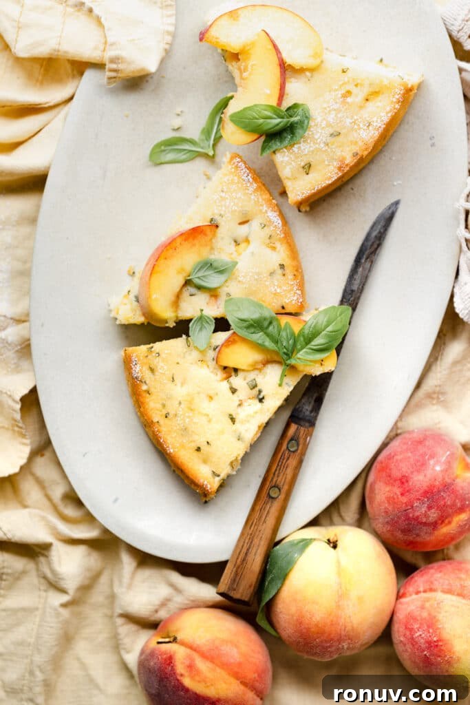 Peach Ricotta Cake with Fresh Basil 4 Three slices of peach cake on an oval platter with a knife.