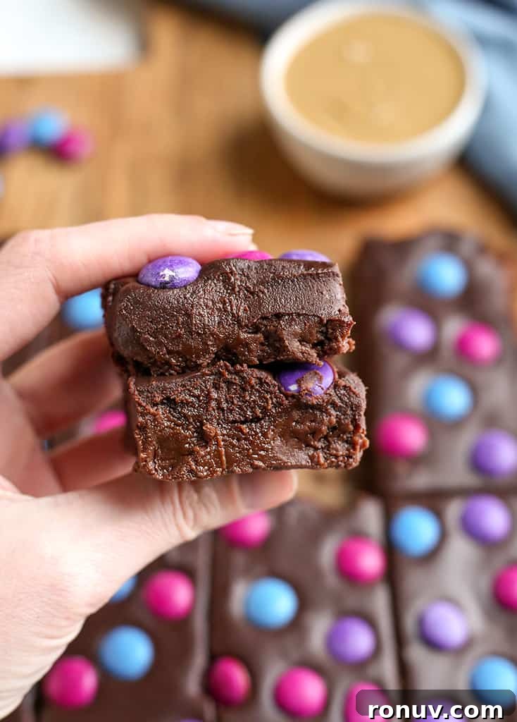 hand holding a stack of two cosmic brownies 