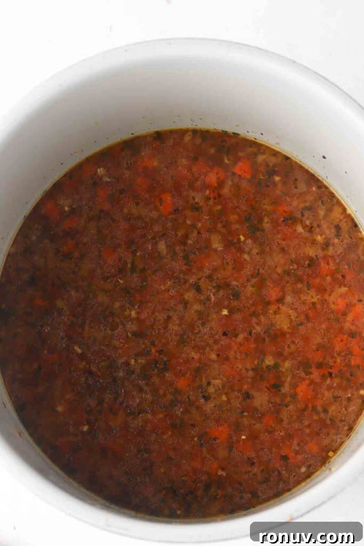 Instant Pot Leftover Turkey Soup Recipe with Vegetables 2 Uncooked instant pot turkey soup ingredients in a pressure cooker base.