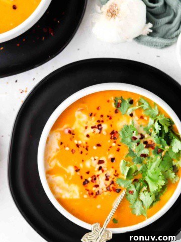 overhead shot of pumpkin soup in bowls