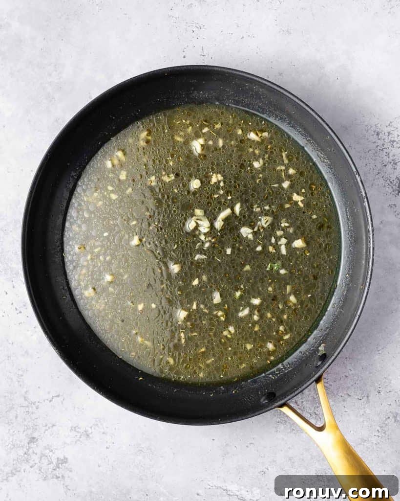 Spinach and Cheese Stuffed Chicken Florentine 13 Chicken broth and Italian seasoning added to the pan.