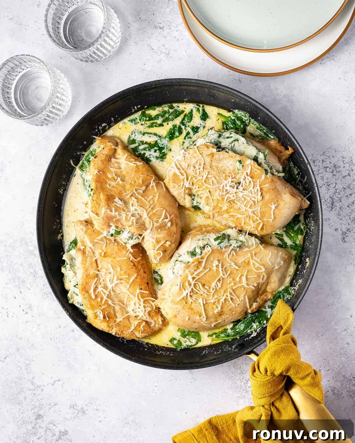 Spinach and Cheese Stuffed Chicken Florentine 17 A pan of stuffed chicken florentine.