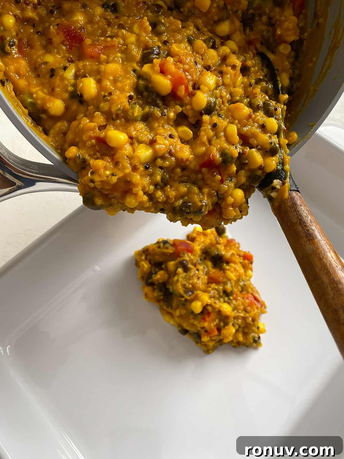 Baked Black Bean and Quinoa Casserole 8 process of adding quinoa casserole to baking dish