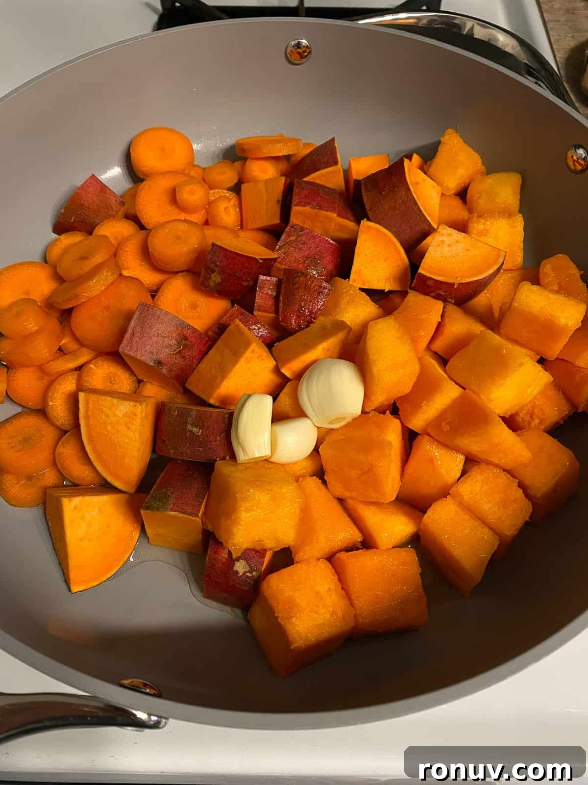 Baked Black Bean and Quinoa Casserole 4 process shot of butternut squash steaming in a pan