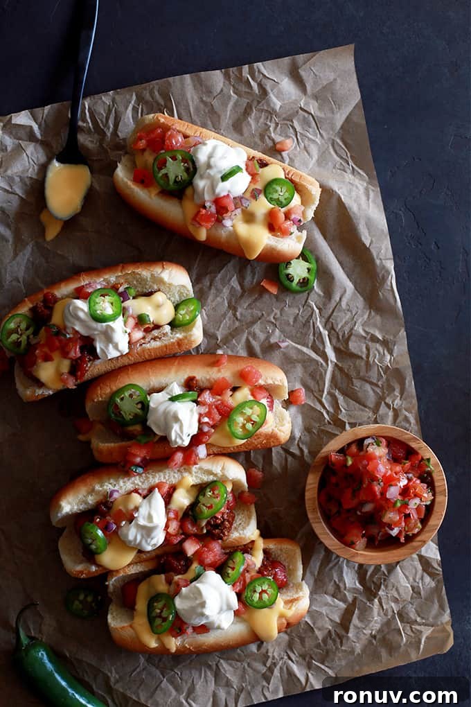 Dodger Stadium Doyer Dogs plated Dodger Stadium Doyer Dogs plated, topped with pico de gallo, jalapeños and beer cheese fondue.
