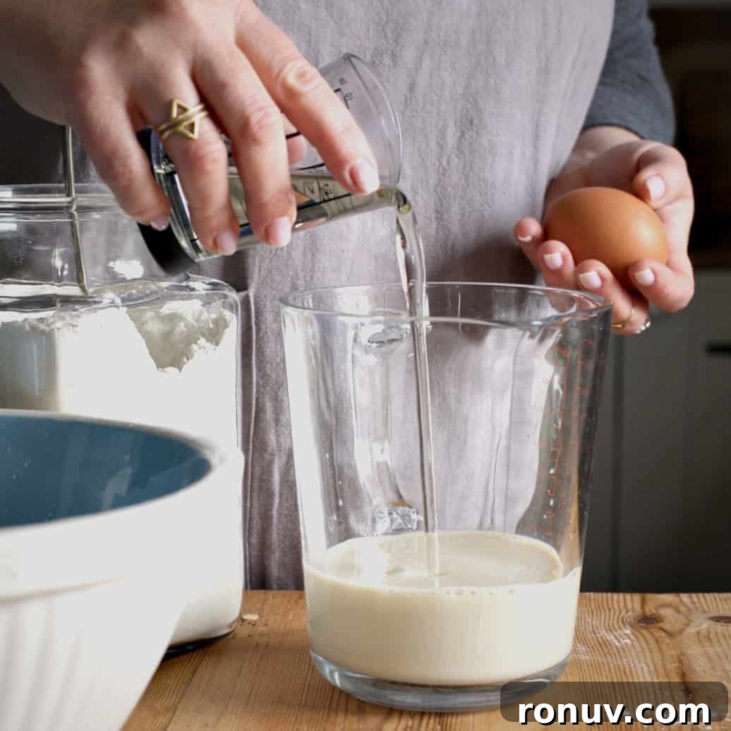 Savory Cheese and Red Onion Muffins: Budget-Friendly Snack 6 Pouring oil into milk