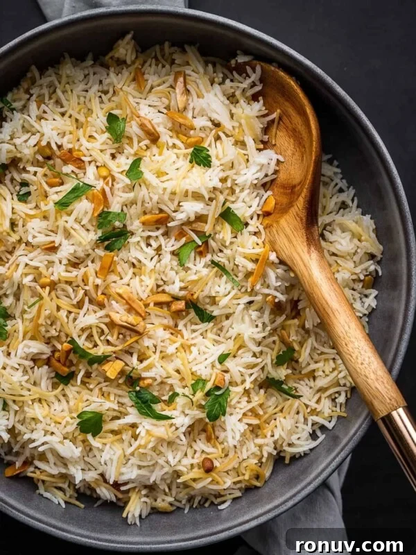 Rice with nuts and parsley on a plate.