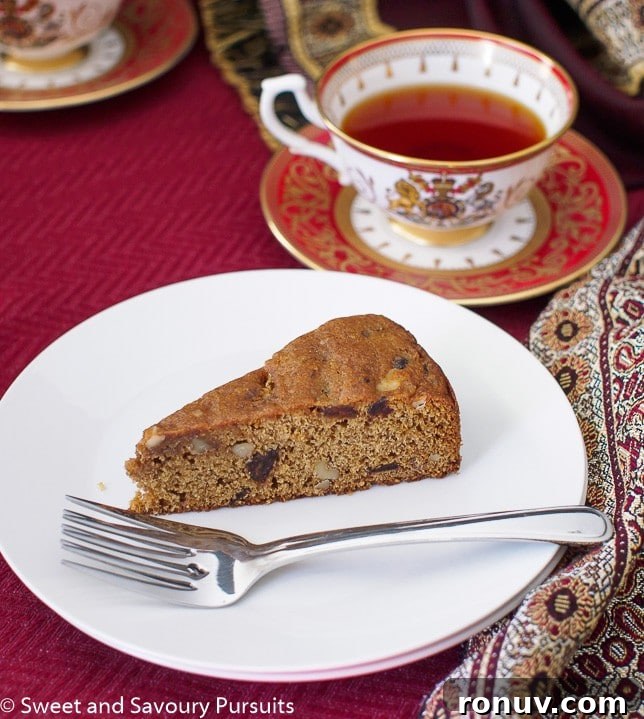 Slice of Date and Walnut Cake on small plate.