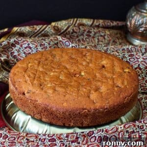 Date and walnut cake on dish.
