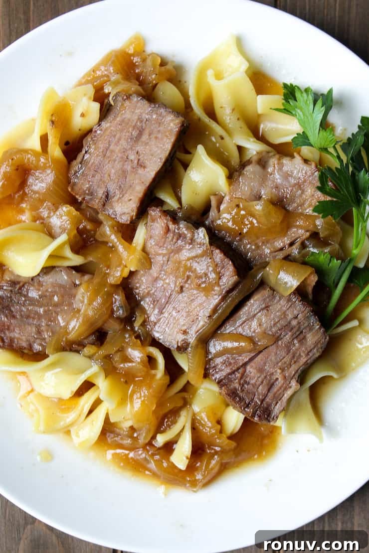 Beer-Braised Beef with Caramelized Onions Recipe 3 Close up of plated beer braised beef and onions