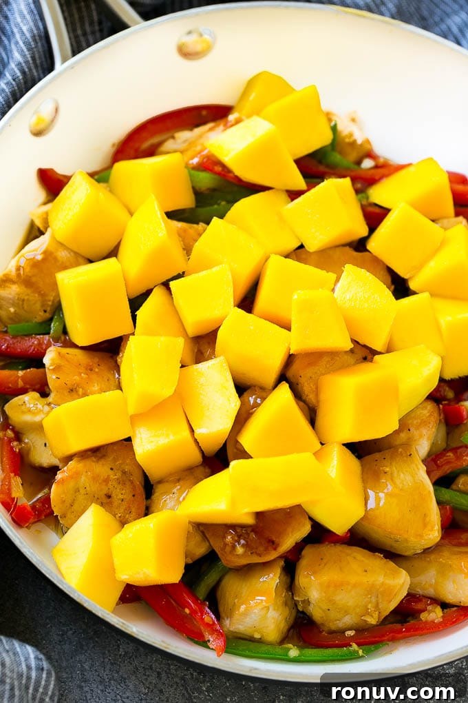Mango chicken stir fry Chicken stir fry with mango chunks.
