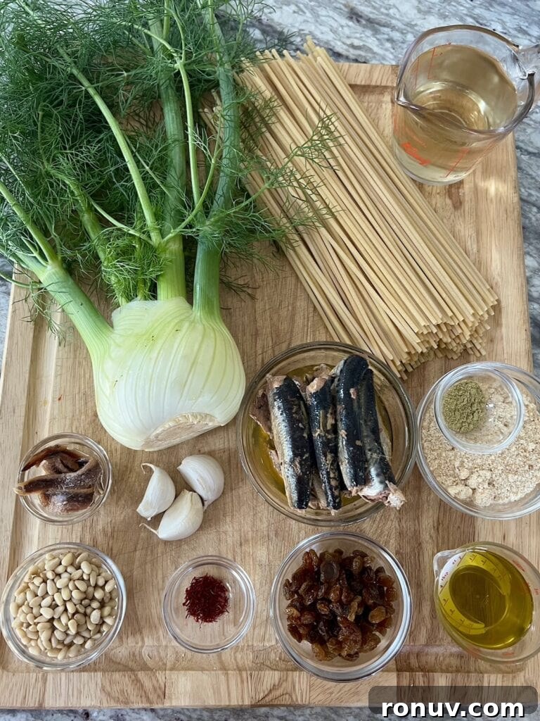 Authentic Sicilian Pasta con Sarde Recipe 5 All ingredients for the pasta con sarde recipe on cutting board.
