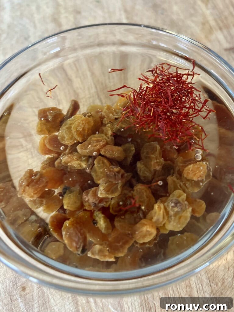 Authentic Sicilian Pasta con Sarde Recipe 6 Soaking yellow raisins and saffron in white wine.