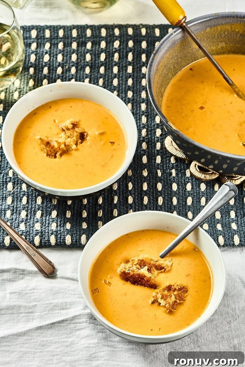 How to Cook Pumpkin: Roast, Puree, Soups and Sides 3 Two white bowls of Pumpkin Curry Soup.