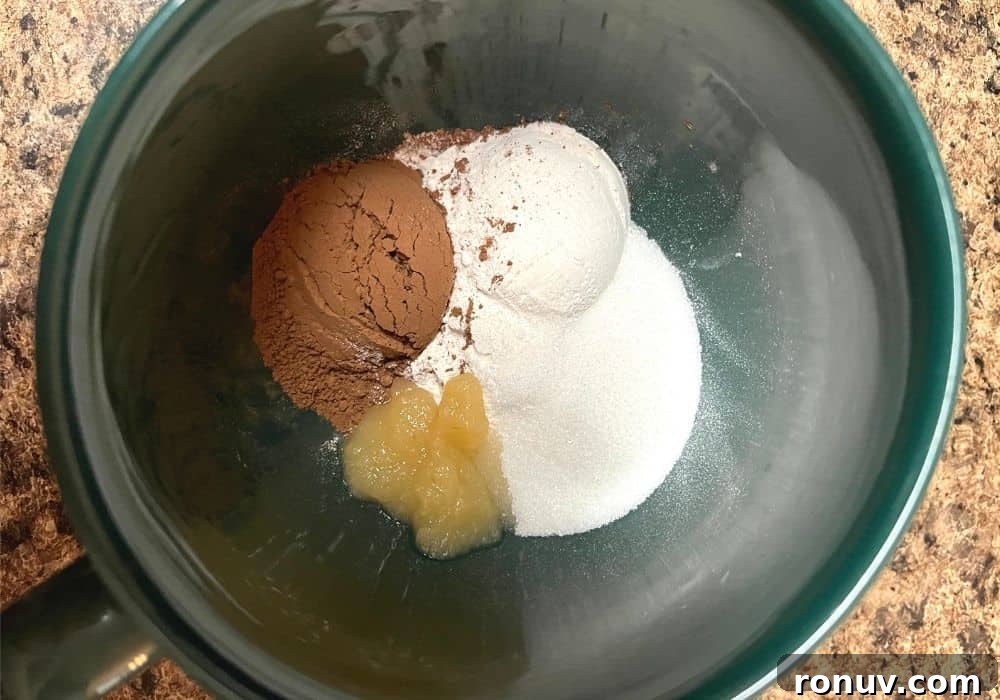 Instant Pot Single-Serve Chocolate Mug Cake 5 flour, sugar, cocoa powder, and applesauce in a mug.