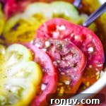 Marinated heirloom tomatoes in a pie dish.