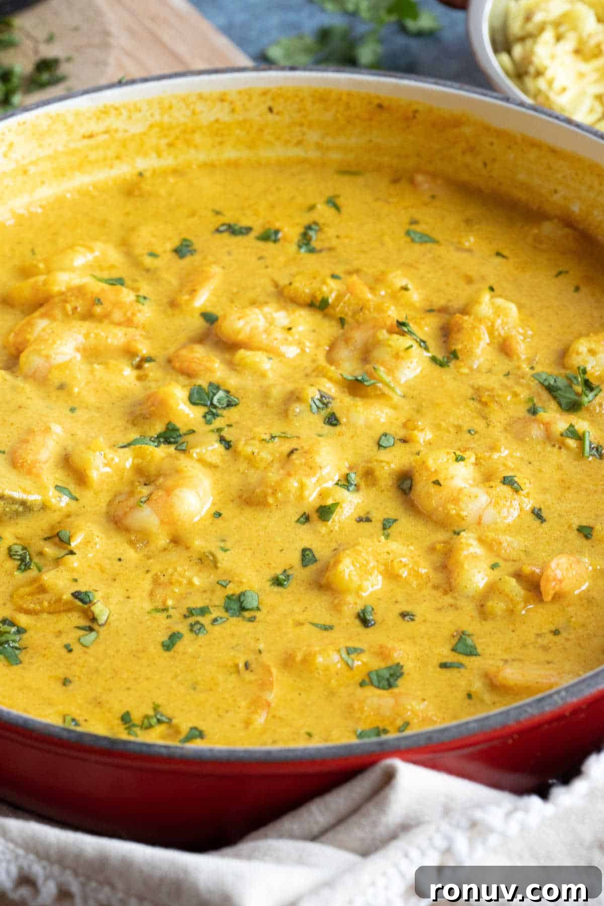 Creamy Prawn Korma Recipe 5 Prawn korma curry garnished with coriander.