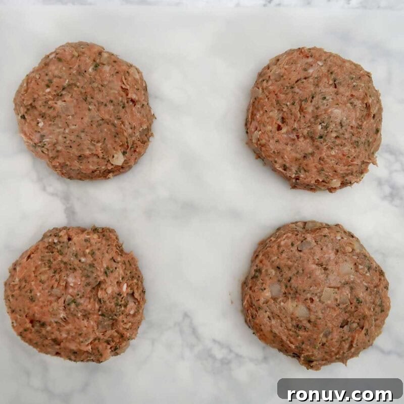 Thai Turkey Burgers with Sweet Chili Glaze 8 Overhead view of burger process shot 3 - divide the burger mixture into 4 sections and form each section into a patty.