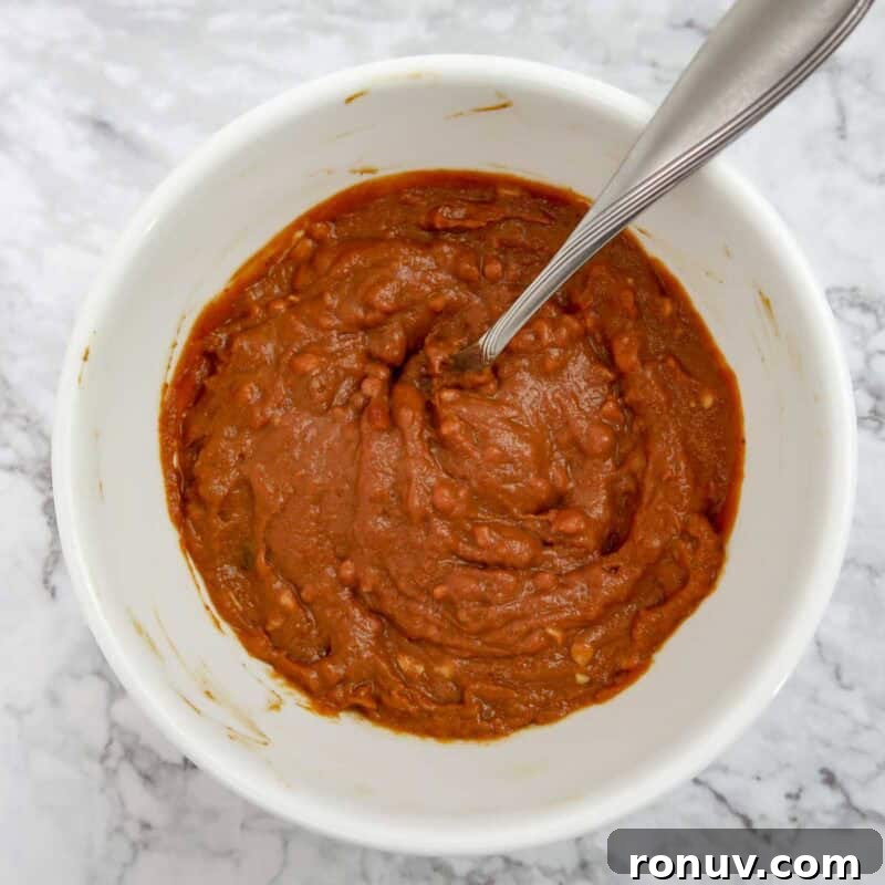 Thai Turkey Burgers with Sweet Chili Glaze 10 Overhead view of peanut sauce process shot 1 - combine the peanut butter, soy sauce, honey, chili paste, and lime juice in a bowl.
