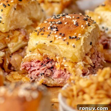 Roast beef slider surrounded by other sliders.