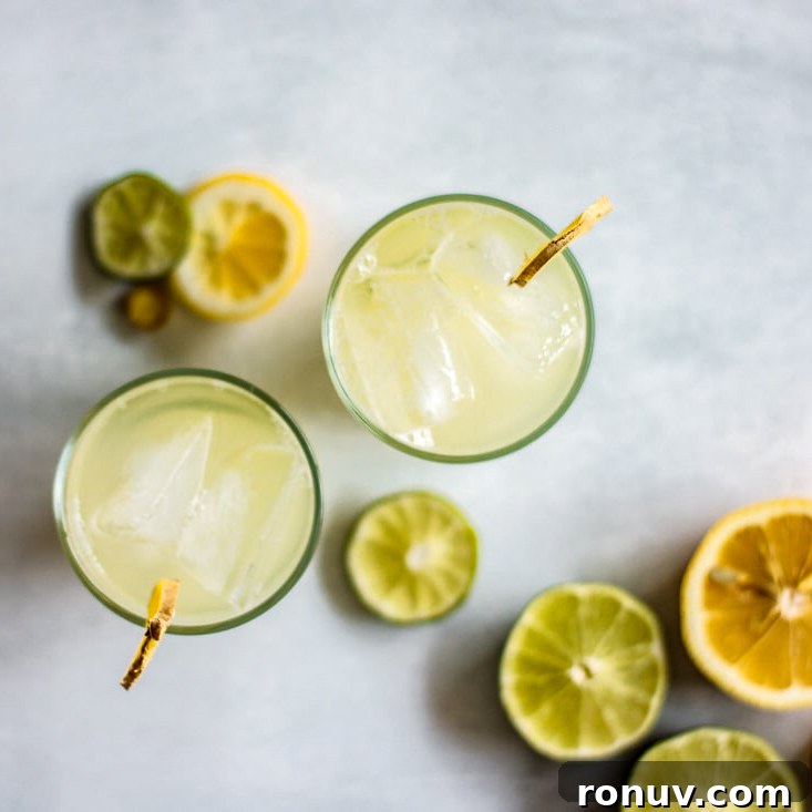Iced Ginger Tea with Honey Recipe 2 Two glasses of ginger honey iced tea, with slices of lemon and lime.