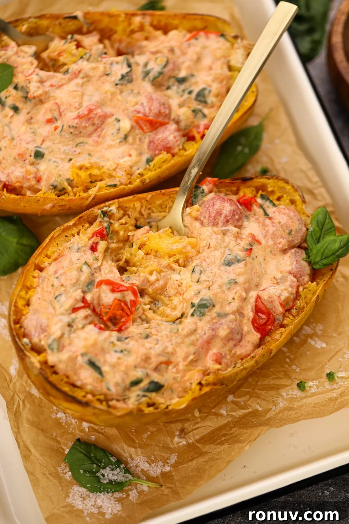 Creamy Boursin Spaghetti Squash Recipe 2 A fork twirling the insides of a stuffed spaghetti squash.