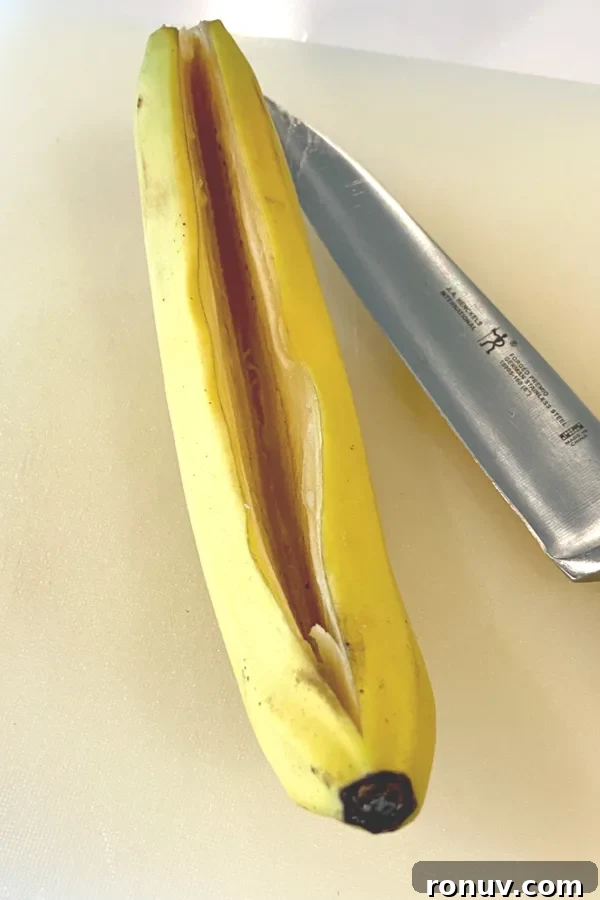 Grilled Banana Split Boats: New Take on a Classic Dessert 3 cutting a banana