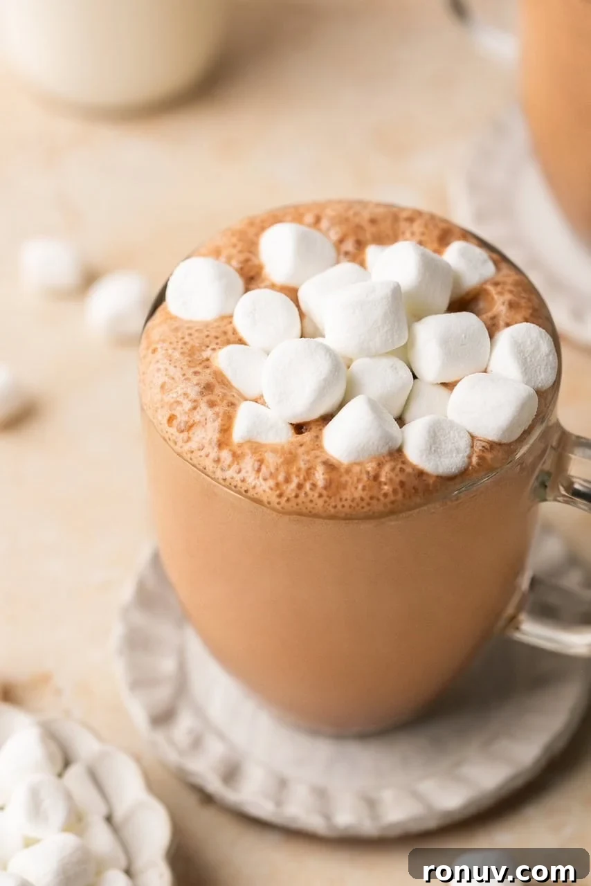bone broth hot chocolate in a glass mug topped with marshmallows