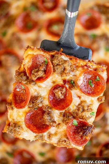 Low Carb Deep Dish Pizza Quiche slice of pizza quiche on a spatula