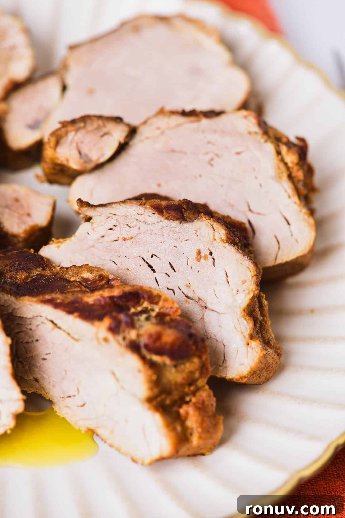 Juicy Marinated Grilled Pork Tenderloin Recipe 7 Sliced pork tenderloin.