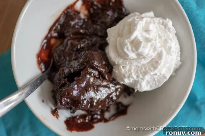 Slow Cooker Chocolate Lava Cake Recipe 4 Crockpot Chocolate Lava Cake in a bowl with whipped cream