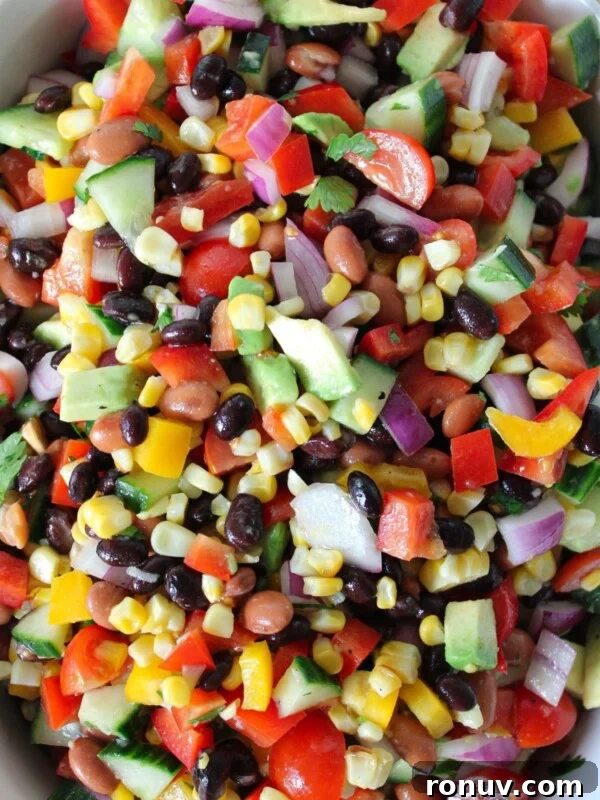 Creamy Jalapeño Popper Potato Salad with Bacon and Cheddar 12 Colorful healthy cowboy caviar in a large dish.