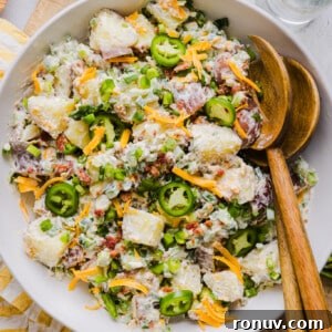 Creamy Jalapeño Popper Potato Salad with Bacon and Cheddar 13 Jalapeño popper potato salad in a large white bowl.